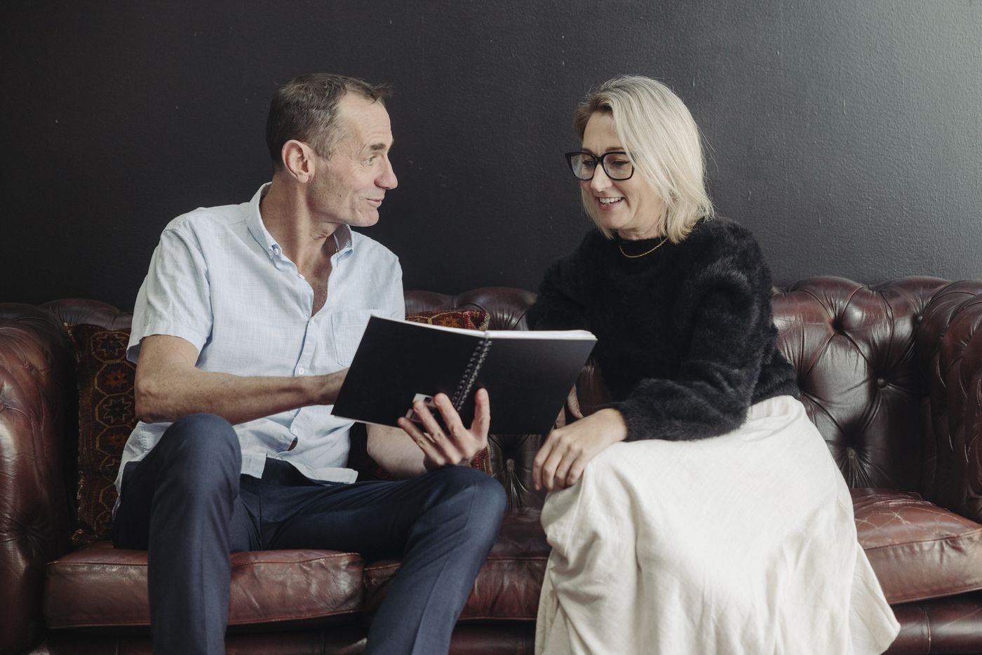 Mike and a client going through notes together